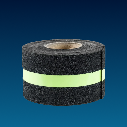 Roll of black foam tape with a green stripe on a blue background