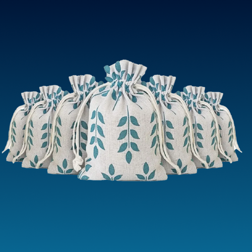 Set of white drawstring bags with green leaf pattern on a blue background