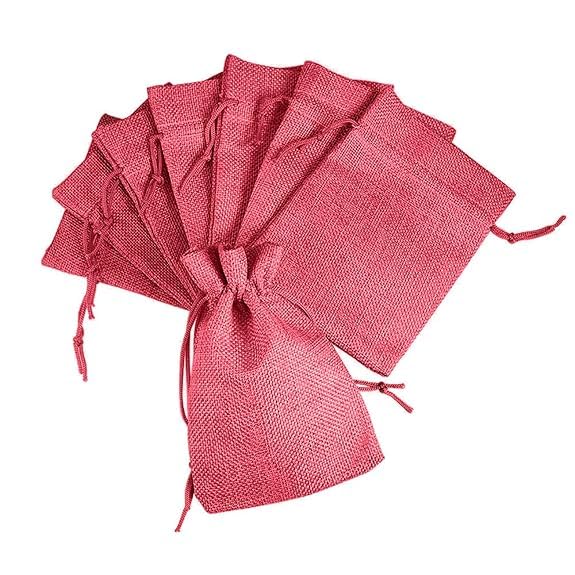 Dark pink jute pouch filled with return gifts – natural linen drawstring bag for birthdays, festivals, and baby showers