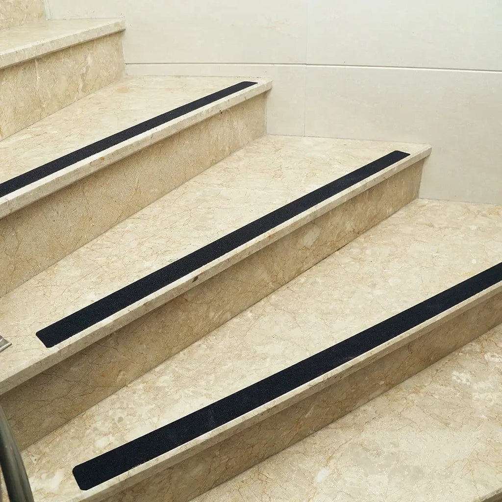 LifeKrafts black anti-skid tape strips applied to indoor marble stairs
