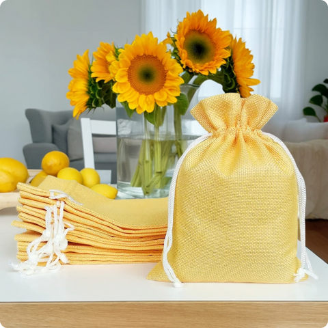 Yellow jute linen pouch with adjustable drawstring closure for gifting and storage
