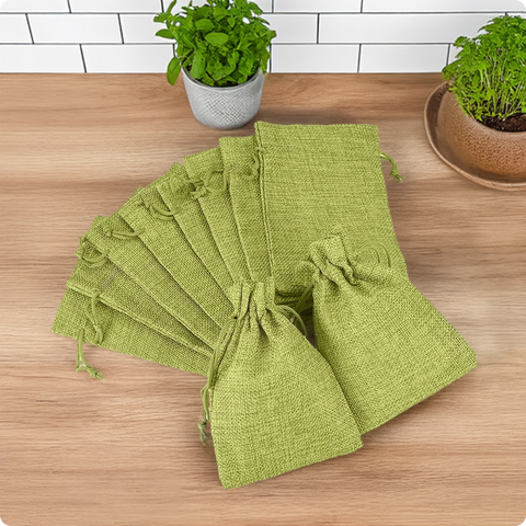 Green jute linen pouch with adjustable drawstring closure for gifting and storage
