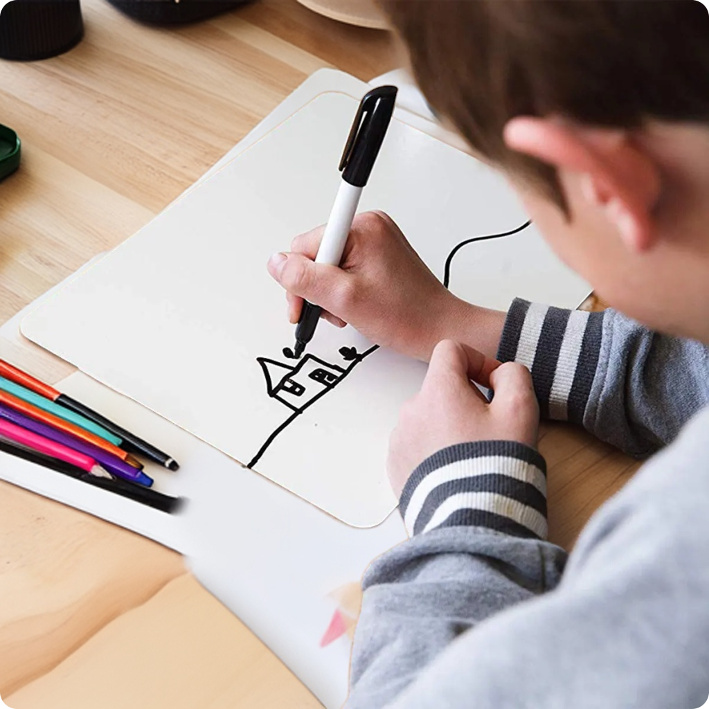 Child drawing on a LifeKrafts dry erase lapboard for home learning and creative activities
