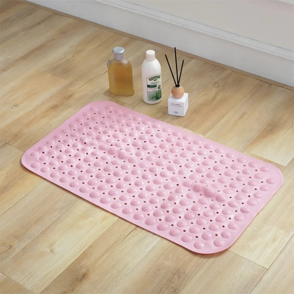 Close-up of pink Accu-Pebble bath mat with raised textured surface for bathroom and shower use