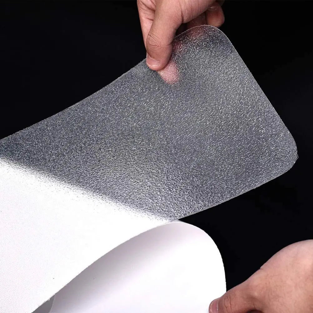 Transparent PEVA anti-skid strip with peel-off self-adhesive backing for stair installation