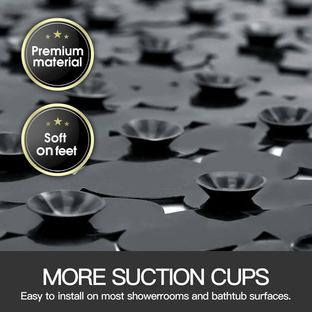 Close-up of black stone pebble bath mat underside showing suction cups