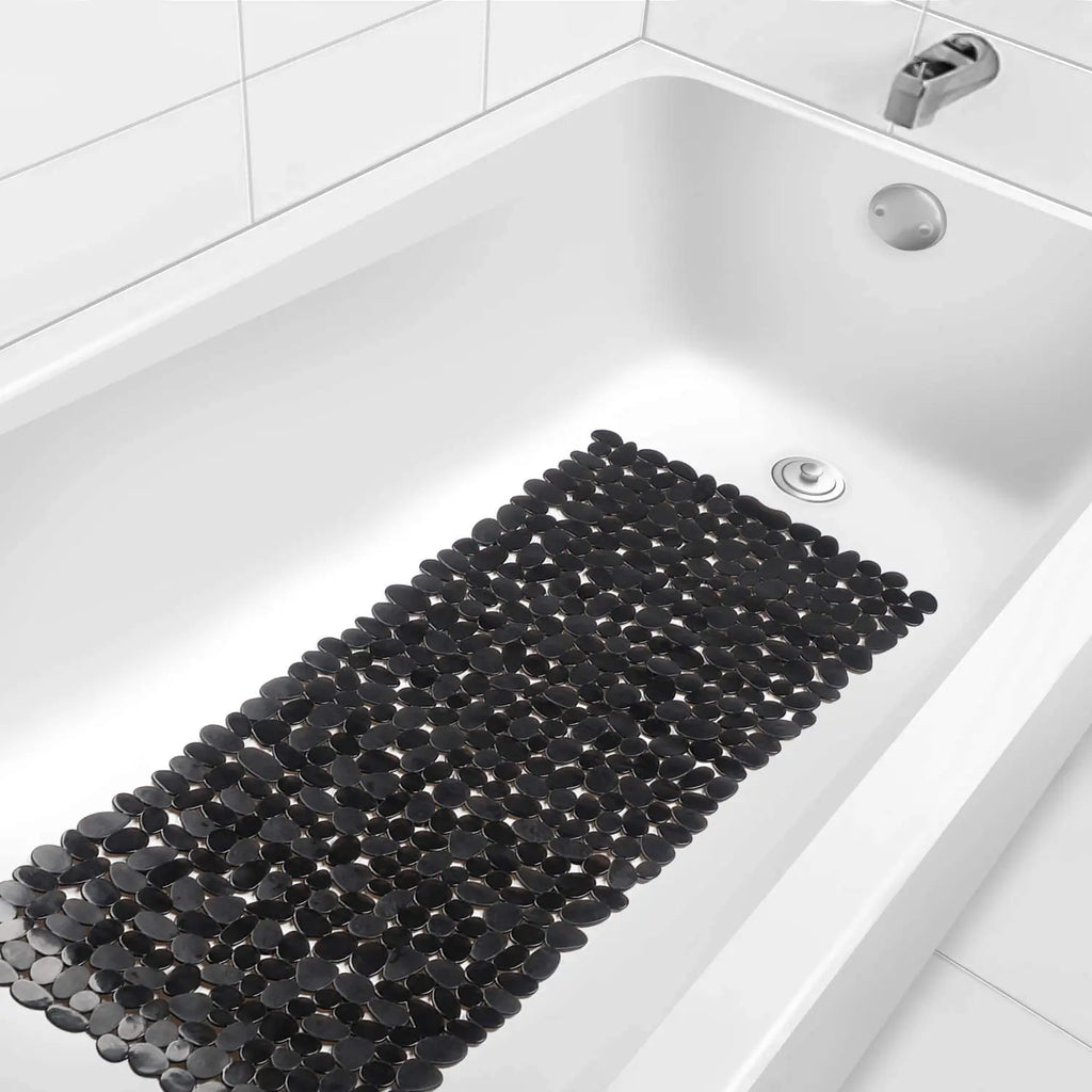 LifeKrafts black stone pebble anti-slip bath mat placed inside white bathtub