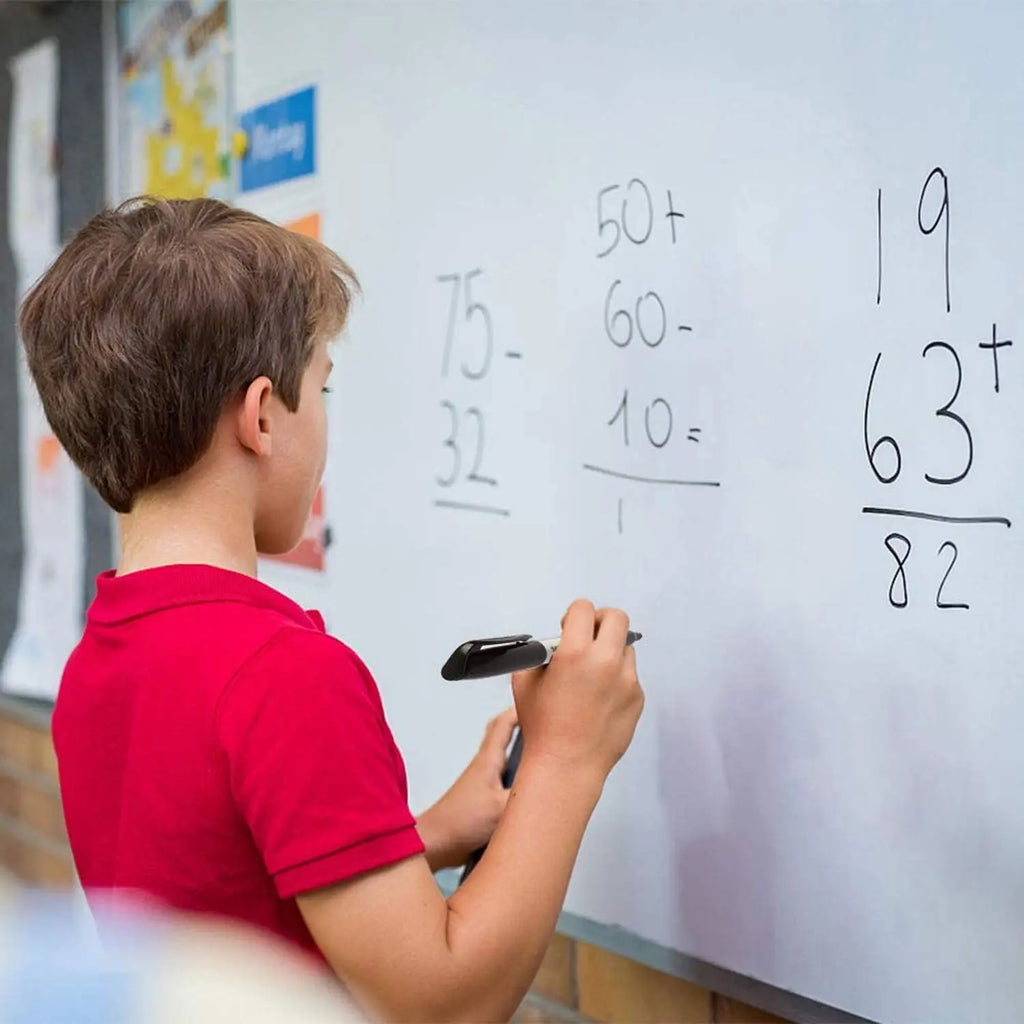 Dry erase marker pen used for writing and solving maths on classroom whiteboard