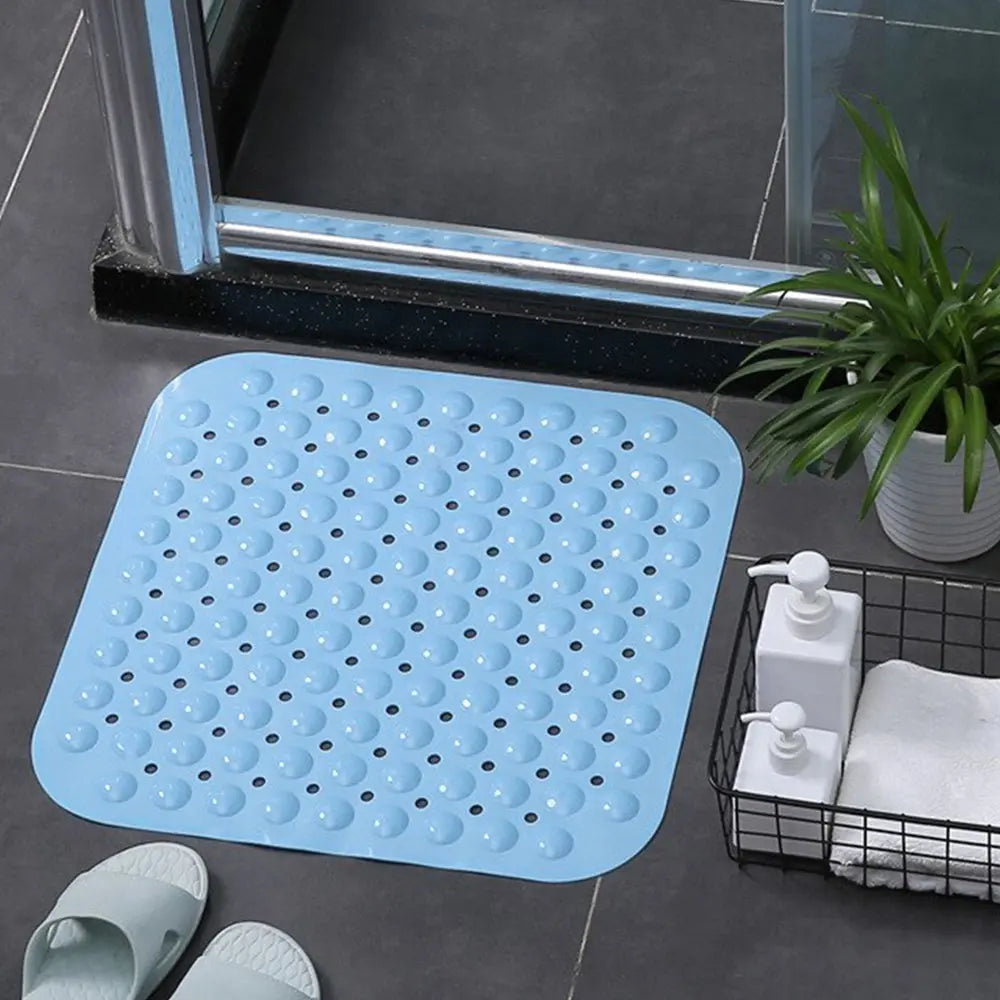 LifeKrafts blue soft pebble anti-slip bath mat on tiled bathroom floor beside shower
