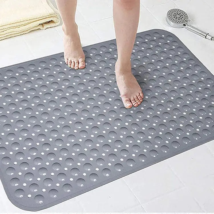 Grey soft pebble anti-slip shower mat with drainage holes for wet bathroom floors