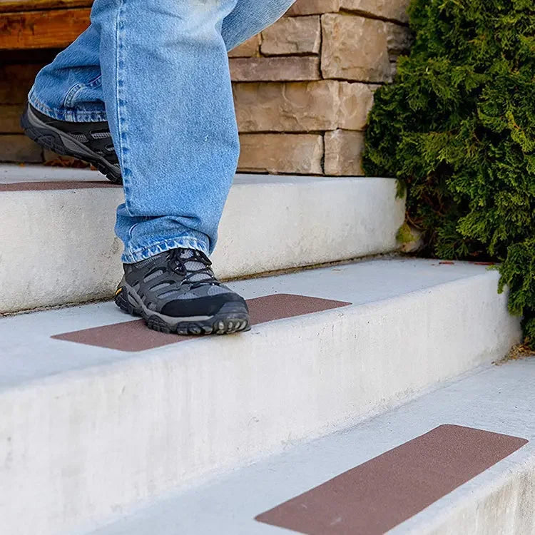 LifeKrafts brown anti-skid tape strips installed on outdoor concrete stairs
