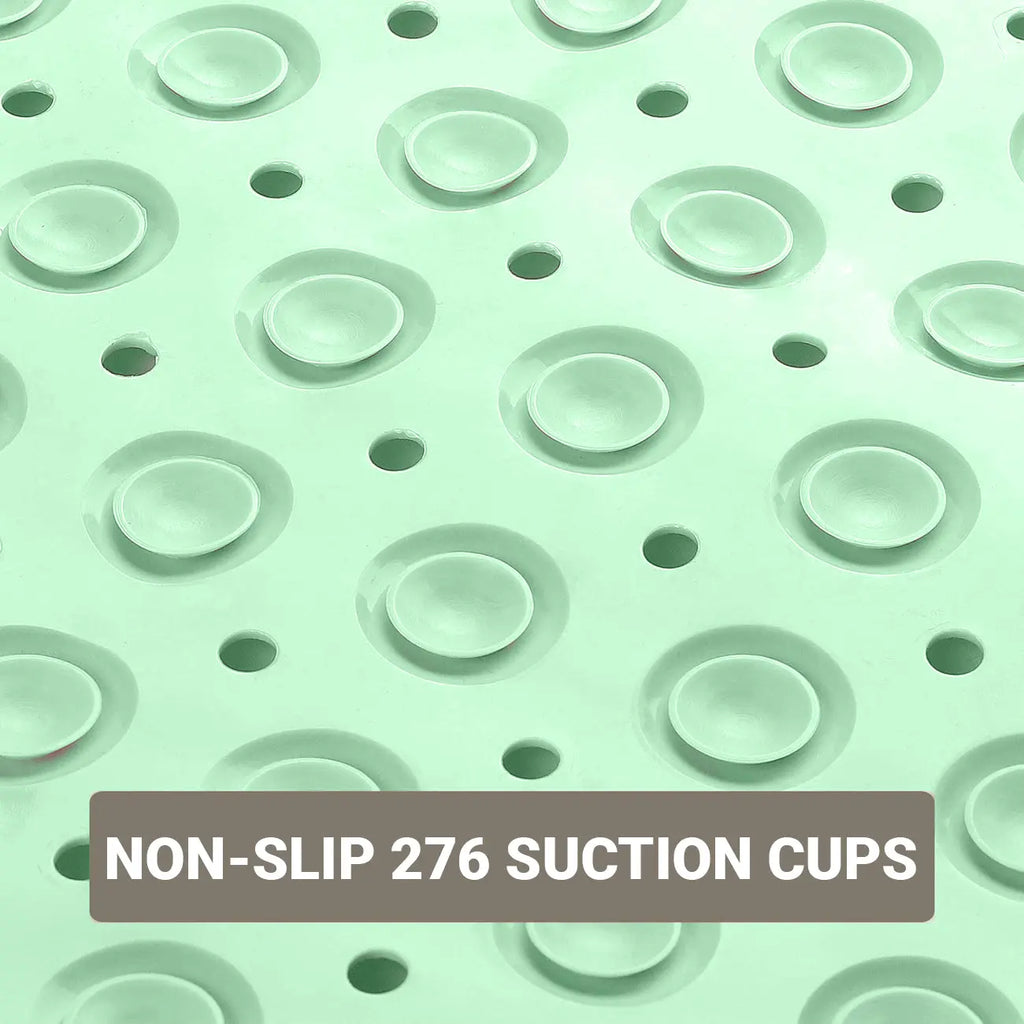 Suction cups and drainage holes on green anti-slip bath mat for secure floor grip