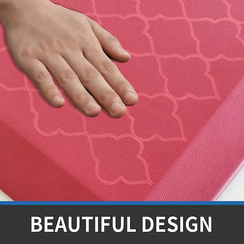 Close-up of red anti-fatigue floor mat with textured decorative surface and cushioned construction