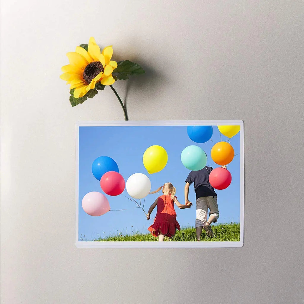 6 x 4 inch magnetic photo frame displaying a family picture on refrigerator