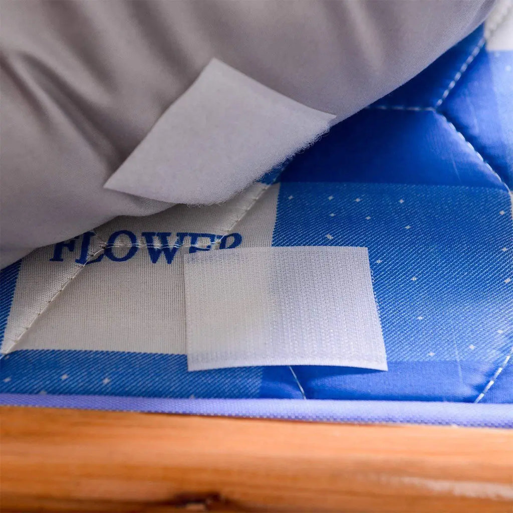 White non-adhesive hook and loop fastener sewn onto fabric for removable fastening