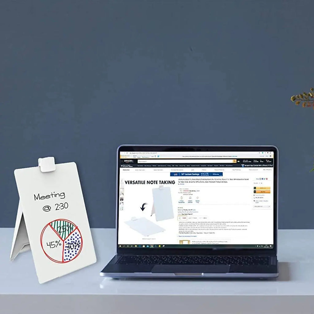LifeKrafts glass dry erase easel board displaying meeting notes beside a laptop