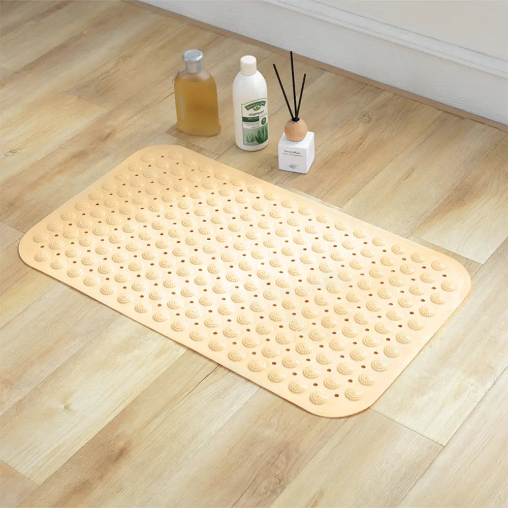 Cream non-skid shower bath mat with Accu-Pebble surface for bathroom floor use