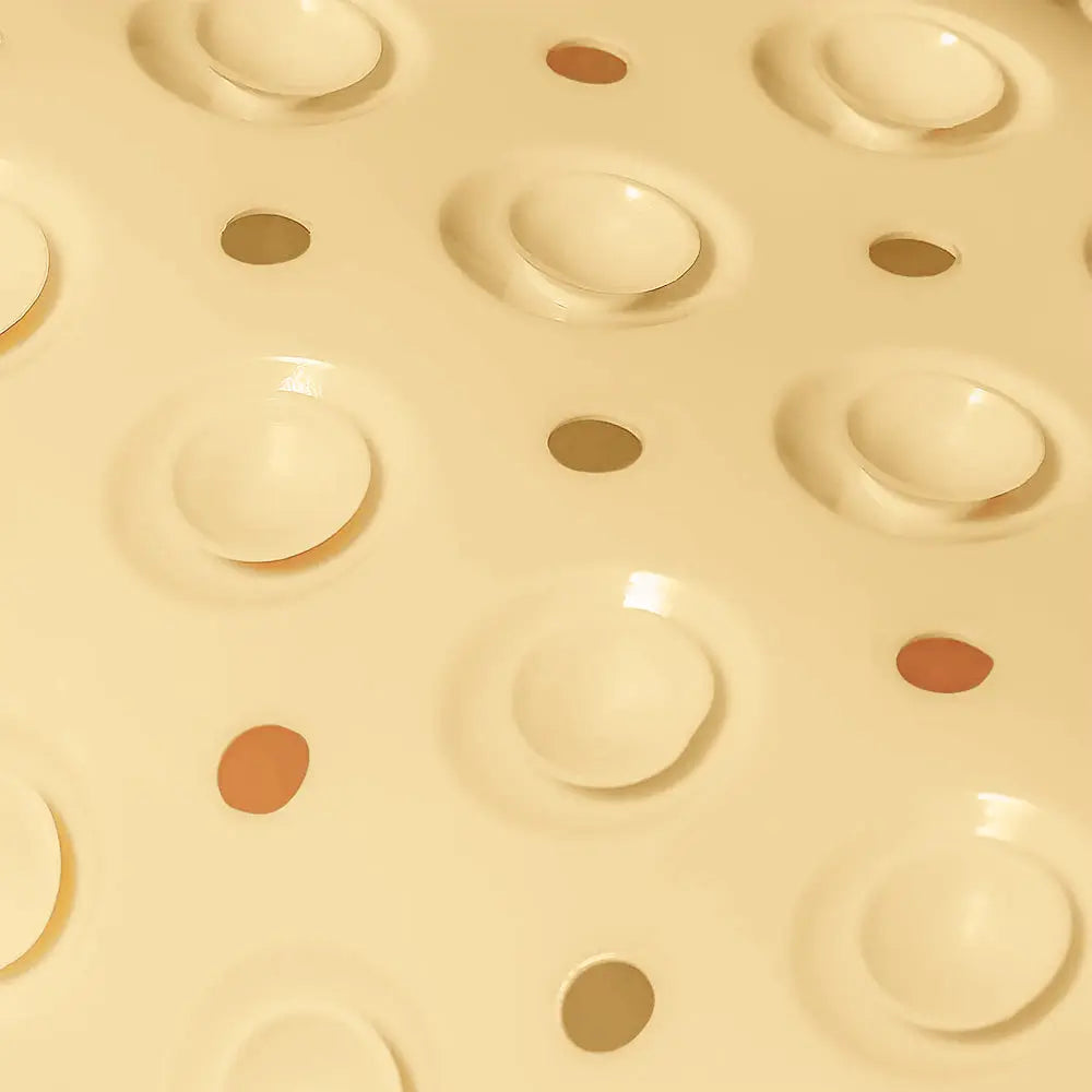 Close-up of cream Accu-Pebble anti-slip bath mat with textured surface