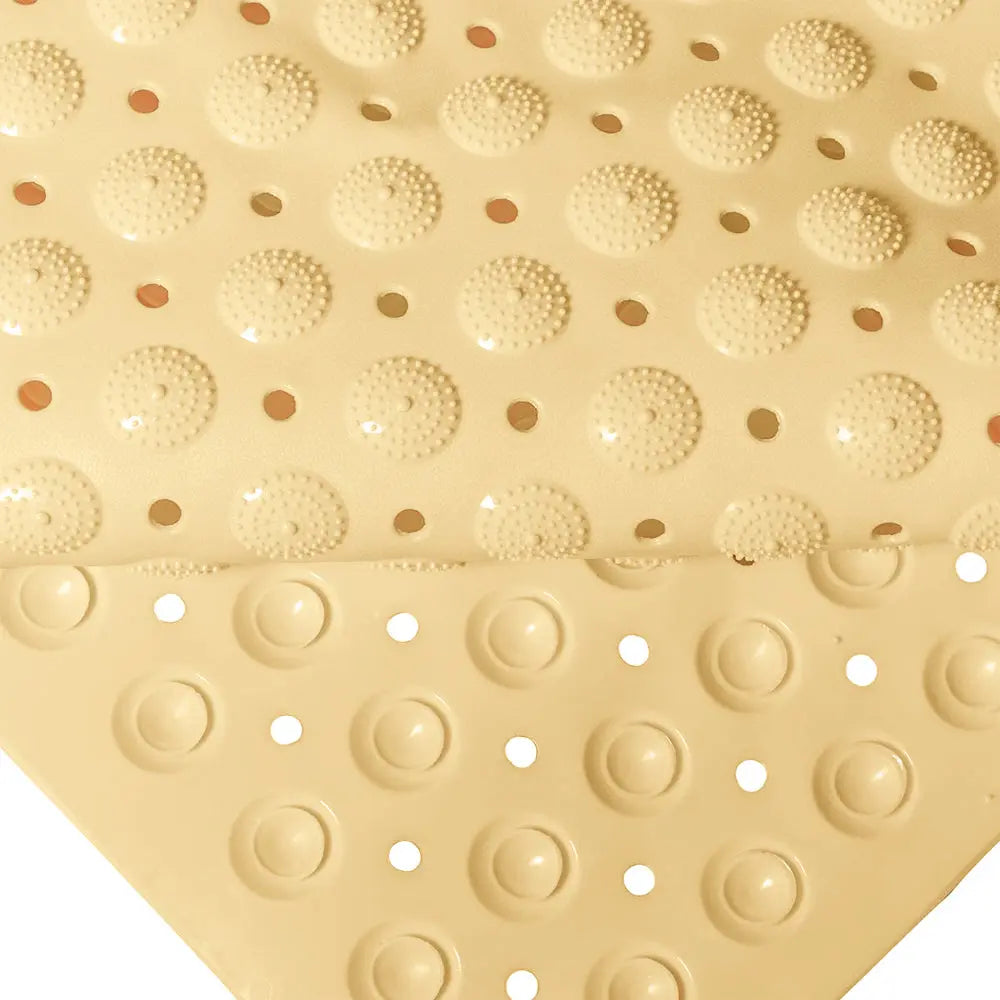 Cream non-slip bathroom mat with suction cup backing for grip on smooth surfaces