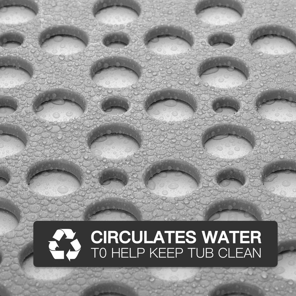 Close-up of grey non-slip bath mat with drainage holes for water circulation