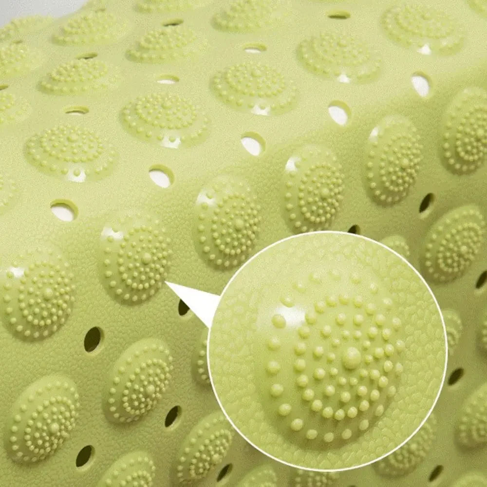Close-up of LifeKrafts green Accu-Pebble bath mat textured massage bumps and drainage holes