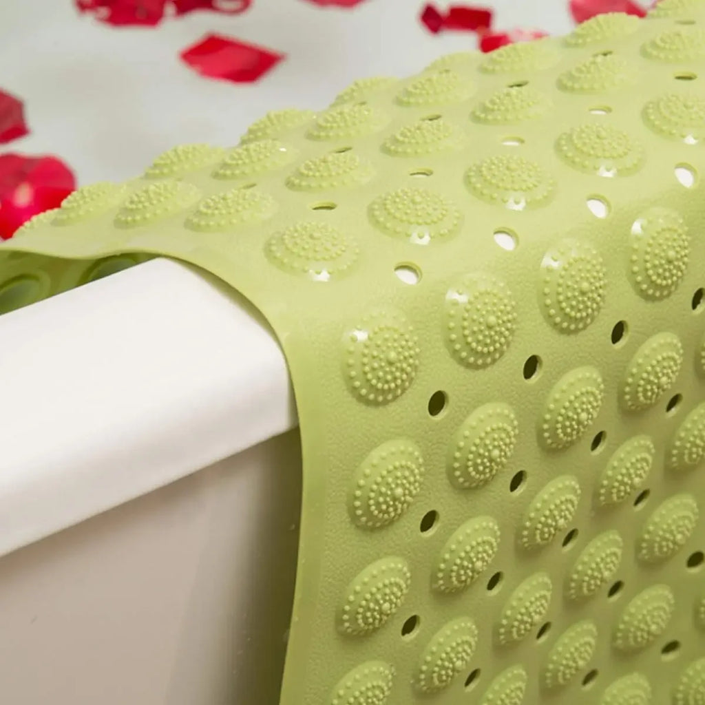 Close-up of LifeKrafts green Accu-Pebble anti-slip bath mat with textured drainage holes
