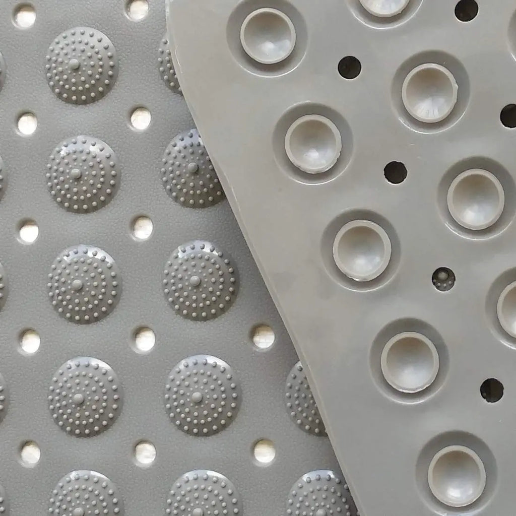 Close-up of grey Accu-Pebble bath mat with raised textured surface